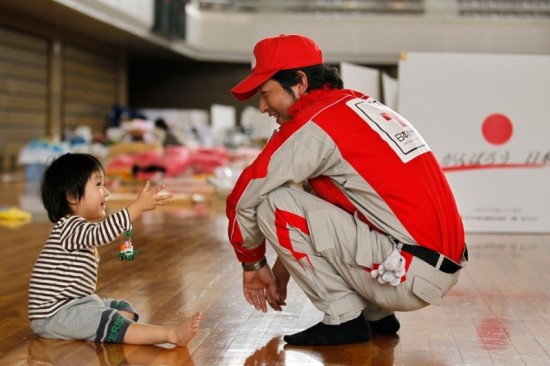 Rui Sato and a Red Cross Worker taken by Hiro Komae (Associated Press)